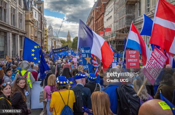 London, UK, 23 Sep 2023, People decked out in EU flags march down Whitehall towards Big Ben at the anti-Brexit EU National Rejoin March in central...
