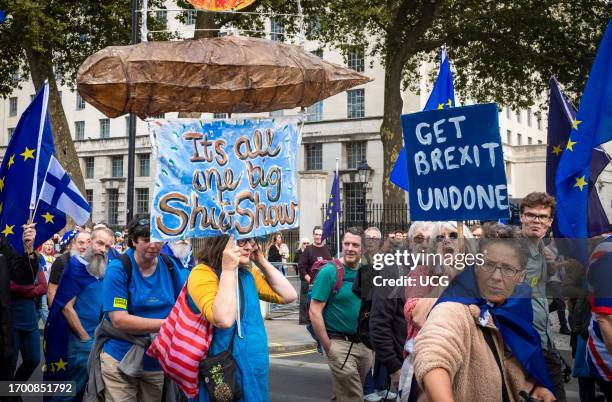 London, UK, 23 Sep 2023, A large sign reading "It's all a shit show" among other placards carried by anti-Brexit protesters at the EU National Rejoin...