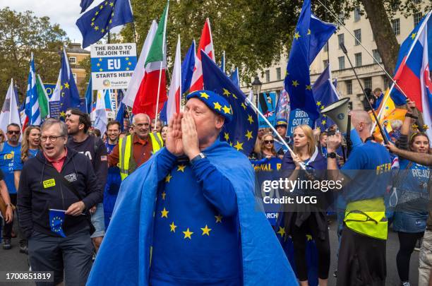 London, UK, 23 Sep 2023, A man wearing the EU flag shouts anti-Brexit insults at Downing Street, where the prime minister resides, at the EU National...