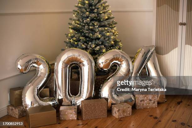 large balls 2024 silver. new year. christmas. home and interior decoration. minimalism. boho style. - invitation stock pictures, royalty-free photos & images