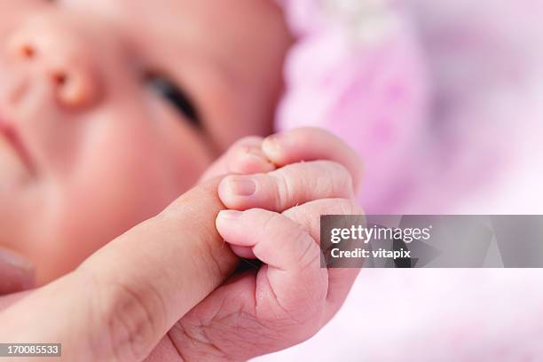 newborn baby girl holding mothers hand - name tag bildbanksfoton och bilder