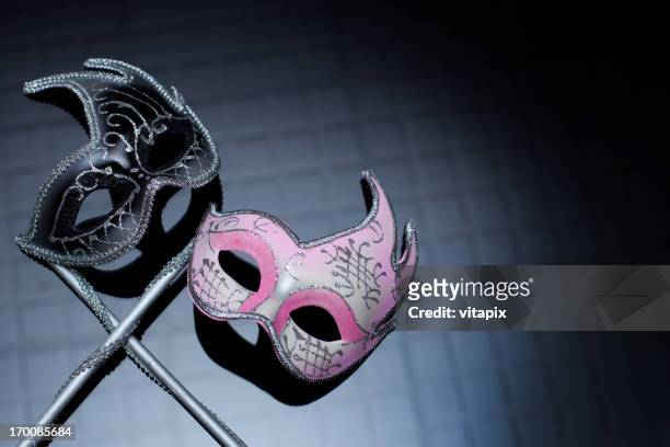 hers and his masks on black background - evening ball stock pictures, royalty-free photos & images
