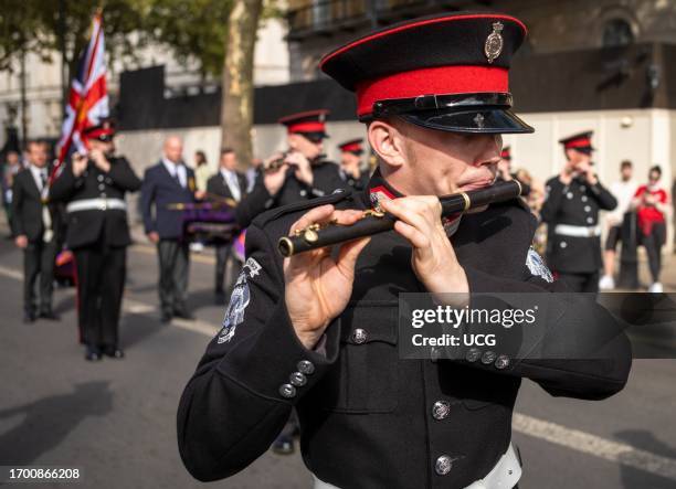 Member of the Irish protestant loyalist paramilitary Ulster Volunteer Force band plays flute at the Cenotaph war memorial in Whitehall, London. Pride...