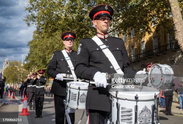 Members of an Irish protestant loyalist paramilitary Ulster Volunteer Force band play drums and flutes at the Cenotaph war memorial in Whitehall,...