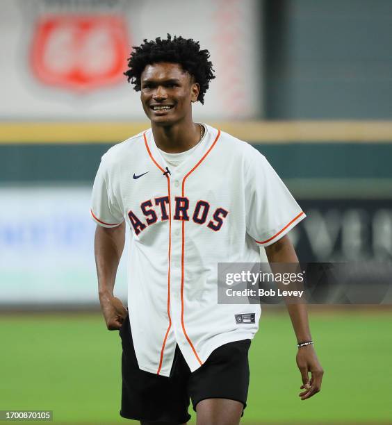 Amen Thompson of the Houston Rockets throws out the first pitch as the Kansas City Royals play the Houston Astros at Minute Maid Park on September...