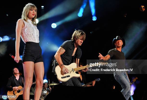 Taylor Swift, Keith Urban, and Tim McGraw perform at LP Field during the 2013 CMA Music Festival on June 6, 2013 in Nashville, Tennessee.