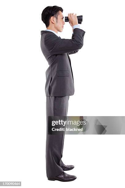 businessman looking through binoculars - spy glass businessman stock pictures, royalty-free photos & images