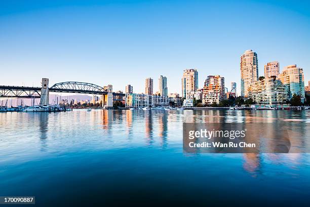 the burrard bridge in granville island - vancouver stock pictures, royalty-free photos & images
