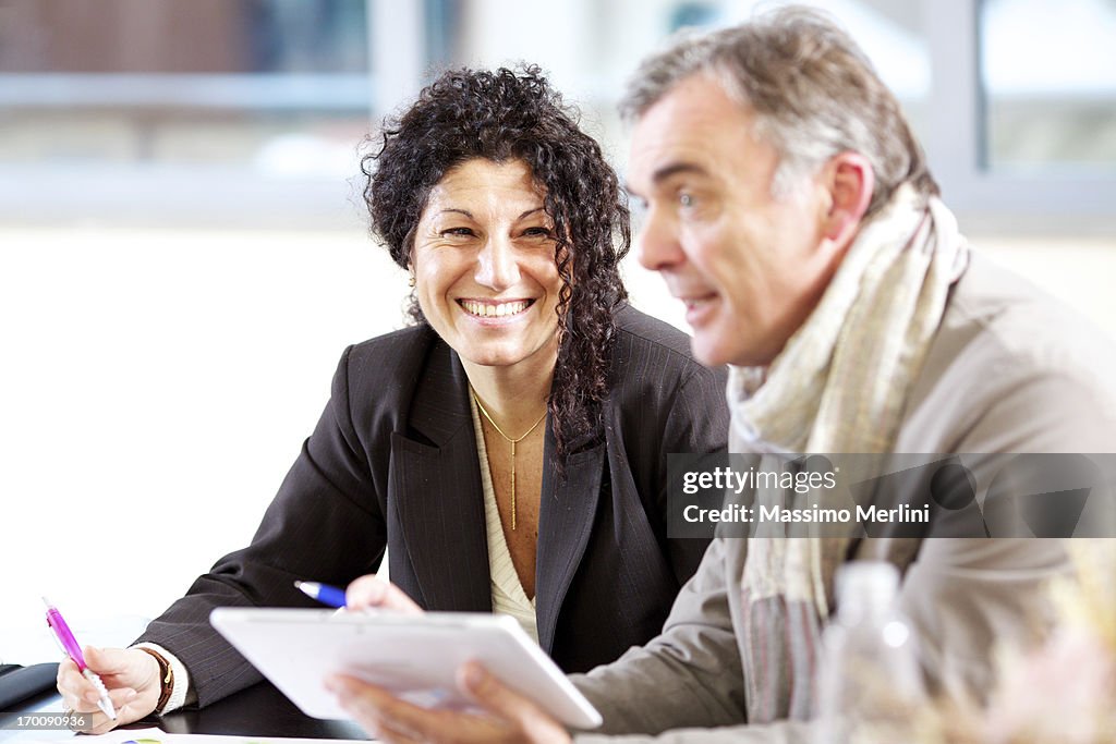 Mature couple giving presentation