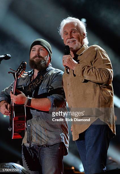 Zac Brown is joined on stage by Kenny Rogers to perform "The Gambler" during the 2013 CMA Music Festival on June 6, 2013 in Nashville, Tennessee.