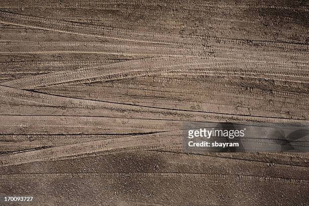 tire tracks - gravel stock pictures, royalty-free photos & images