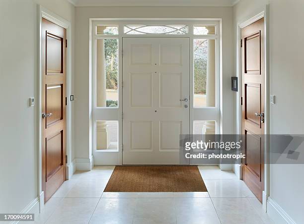 front door entrance to grand house - indoors stock pictures, royalty-free photos & images
