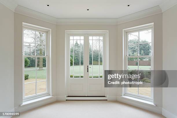 white bay windows and french doors - french window bildbanksfoton och bilder