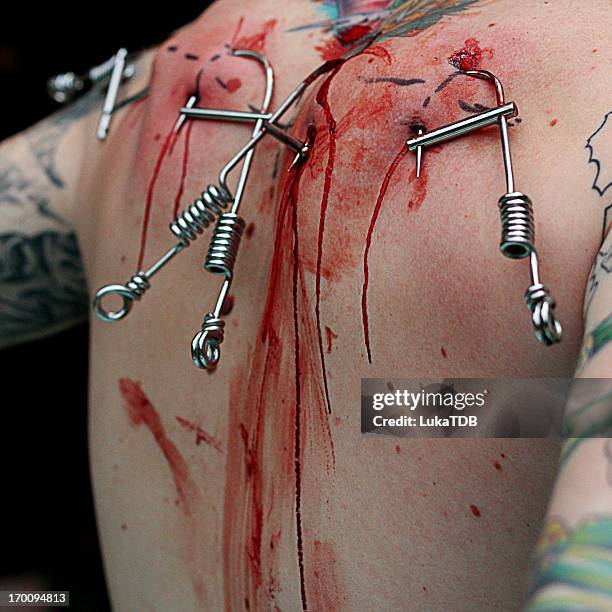 haken und blut - body piercings stock-fotos und bilder