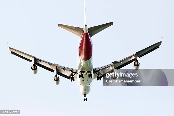 low angle view flying airbus a380 against sky, copy space - airbus a380 stock pictures, royalty-free photos & images