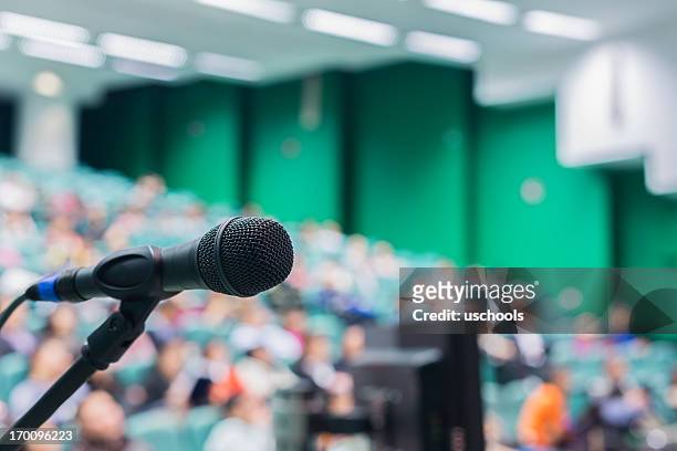 microphone in front of people - stage performance space stock pictures, royalty-free photos & images