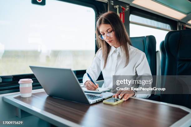 balancing digital and manual work - woman exiting train stock pictures, royalty-free photos & images