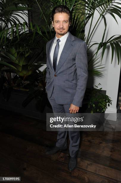 Actor Jeremy Renner celebrates with Kristoffer Winters the launch of Robb Report "Home & Style" on June 6, 2013 in Los Angeles, California.