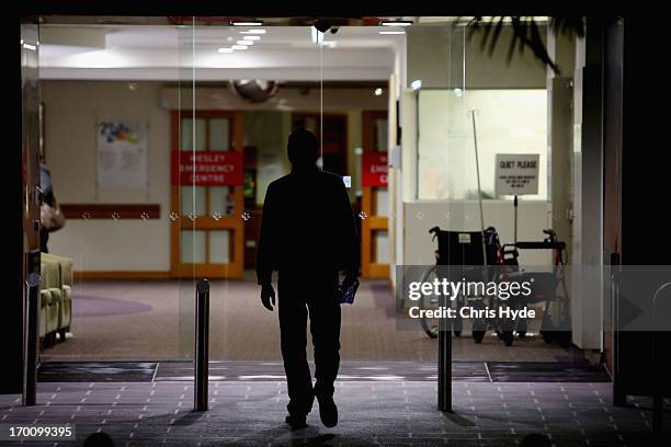 Person enters The Wesley Hospital, the site of a Legionnaires outbreak, on June 7, 2013 in Brisbane, Australia. An investigation is underway to...