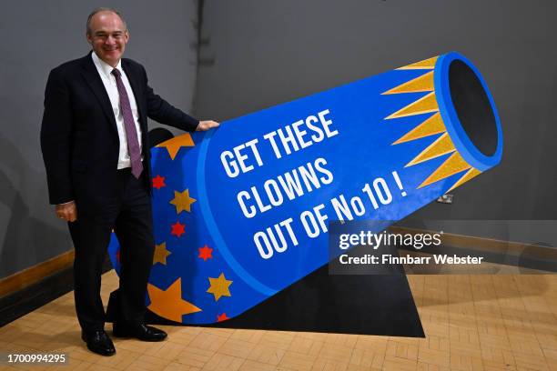 Sir Ed Davey, leader of the Liberal Democrats, poses with a cann prop in the exhibition hall, at Bournemouth International Centre, at Bournemouth...