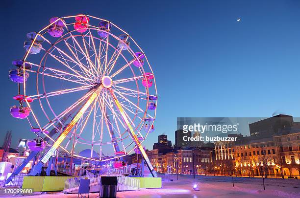 ferris wheel in old montreal during winter - montréal stock pictures, royalty-free photos & images