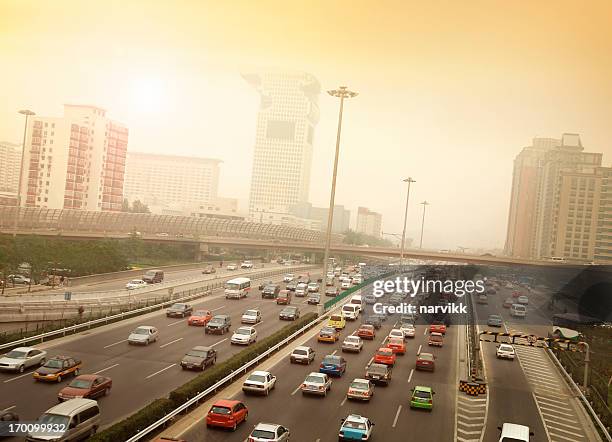 smog and traffic jam in beijing - car pollution stock pictures, royalty-free photos & images