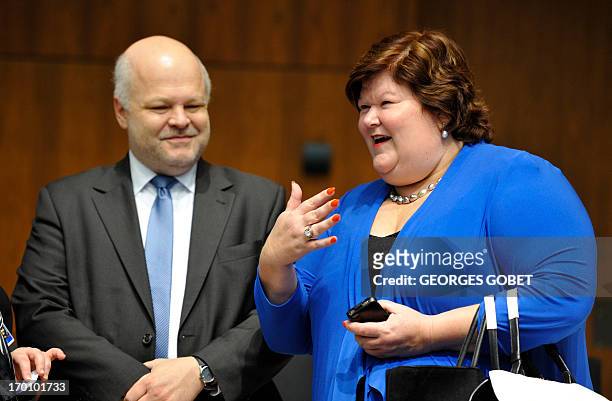 Polish State secretary Piotr Stachanczyk and Belgian State Secretary of Home Affairs Maggie De Block talk prior to a Home Affairs Council on June 6,...