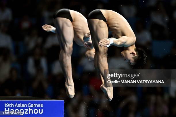 China's Yang Hao and Lian Junjie compete in the men's 10m synchronised diving event during the Hangzhou 2022 Asian Games in Hangzhou, in China's...