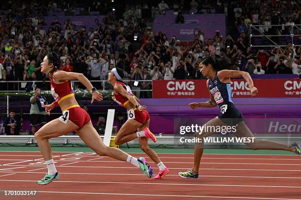 Lin Yuwei Sprinter China's Lin Yuwei crosses the finish line to win the women's 100m ...