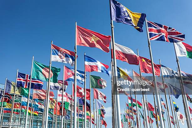 flags in wind - different nationalities stockfoto's en -beelden