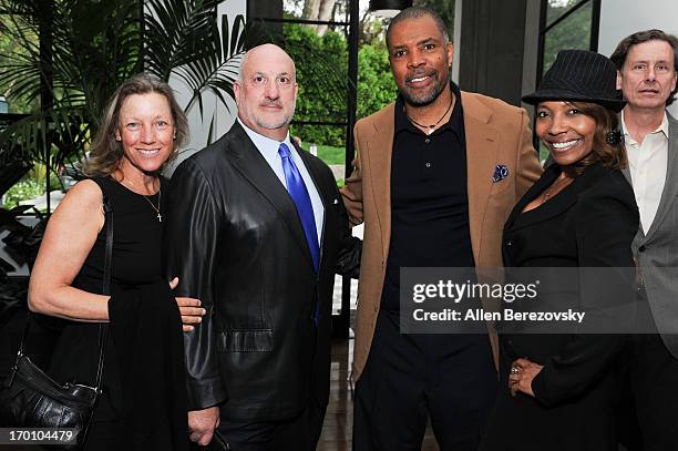 Lisa Curtis, Bill Curtis, actor Eriq La Salle and a guest attend Jeremy Renner's and Kristoffer Winters' celebration of the launch of Robb Report...