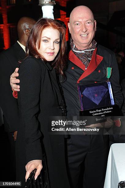 Priscilla Presley and chef Bruno Serato attend a Celebration of All Fathers' Gala Dinner with Andrea Bocelli at Paramount Studios on June 6, 2013 in...