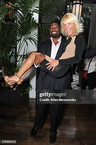 DeMarcus Williams and Debbie Heller attend Jeremy Renner's and Kristoffer Winters' celebration of the launch of Robb Report "Home & Style" on June 6,...