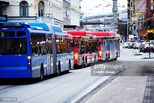 buses in the city traffic - stockholm stock pictures, royalty-free photos & images