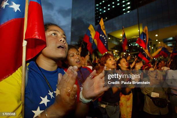 Venezuelan sing during an emotional outdoor Christmas Eve service organized by the opposition supporters December 24,2002 in Caracas, Venezuela....