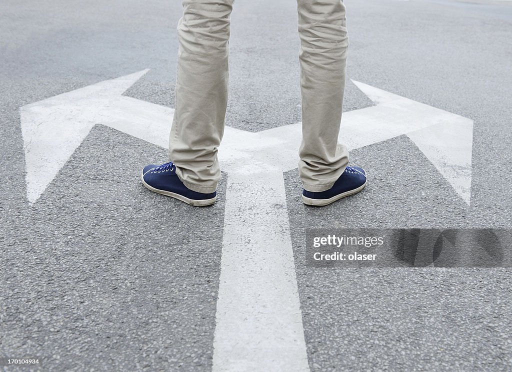 Man standing hesitating to make decision