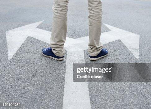 Man standing hesitating to make decision Man standing hesitating to make decision
