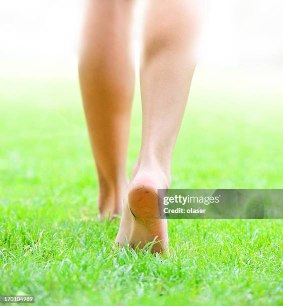 walking into bright light - barefoot soles female stock pictures, royalty-free photos & images