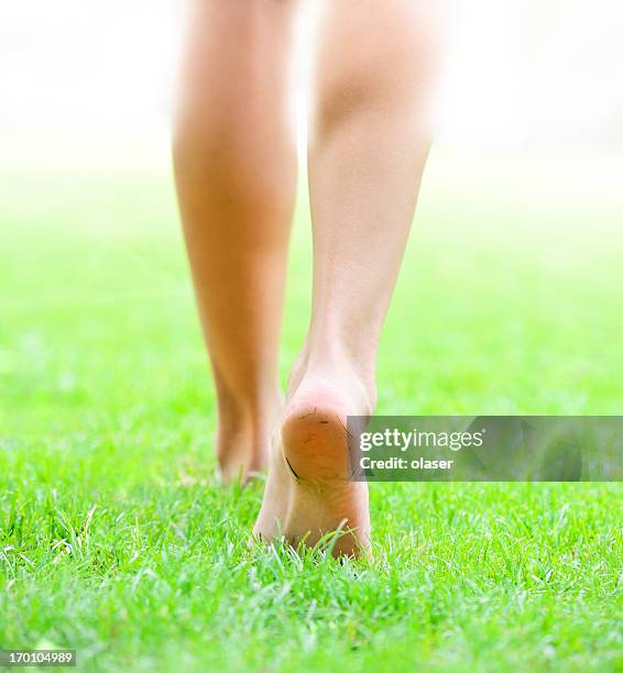 walking into bright light - barefoot grass stock pictures, royalty-free photos & images