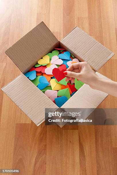 holding red heart - cardboard box top view stock pictures, royalty-free photos & images