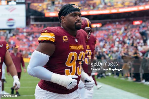 Jonathan Allen of the Washington Commanders walks to the locker room after warmups before a game against the Buffalo Bills at FedExField on September...