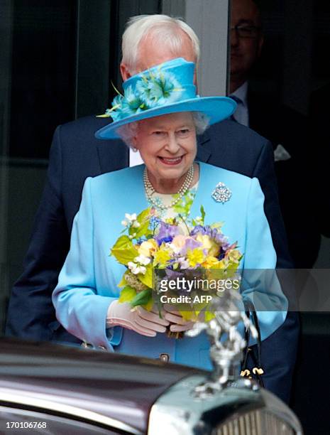 Britain's Queen Elizabeth II leaves after officially open BBC Broadcasting House in central London on June 7, 2013. The Queen continued with her...