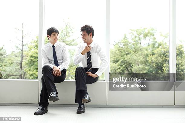 4person business man - asian man seated stockfoto's en -beelden