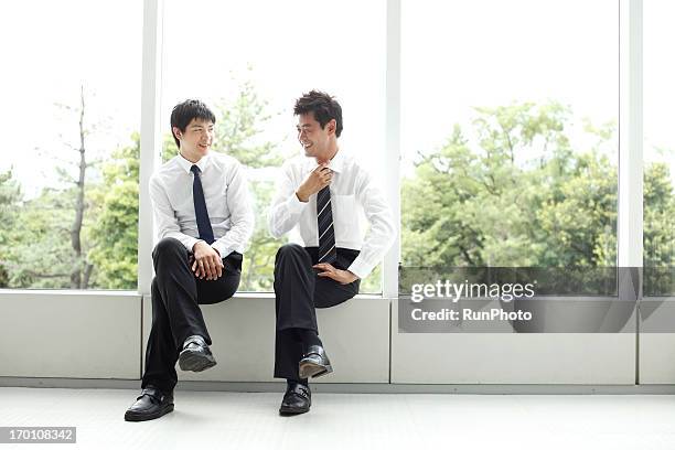 4person business man - asian man sitting at desk stock pictures, royalty-free photos & images