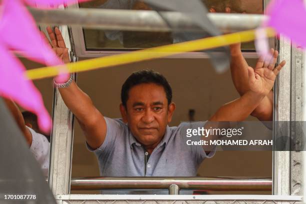 Former President of the Maldives Abdulla Yameen, imprisoned on the charges of alleged corruption waves towards his supporters gathered outside his...
