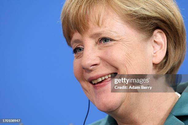 German Chancellor Angela Merkel reacts during a press conference with Tunisian Prime Minister Ali Laarayedh in the German federal chancellery on June...