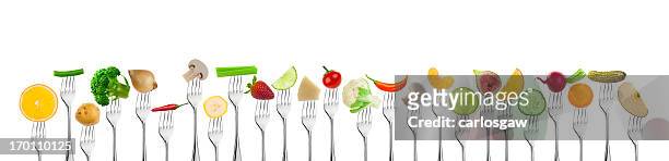 fruits and vegetables on fork - sliced pickles stockfoto's en -beelden