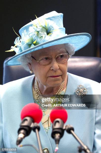 Britain's Queen Elizabeth II visits Radio 4 studios during her visit to the BBC as she officially opened the corporation's new headquarters in London...