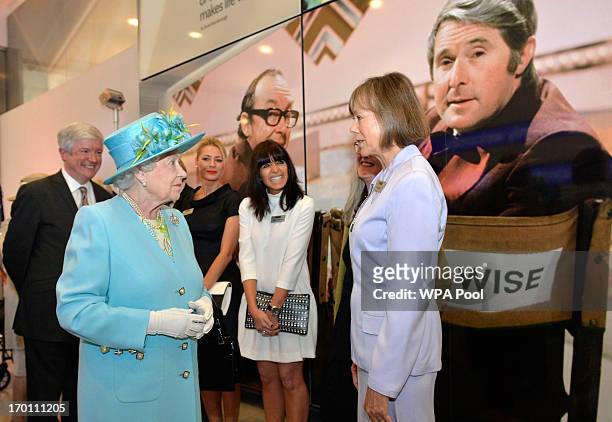 Queen Elizabeth II meets presenter Claudia Winkleman and actress Jenny Agutter as she opens the new BBC Broadcasting House on June 7, 2013 in London,...