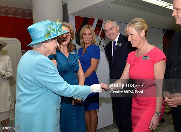 Queen Elizabeth II meets weather presenter Carol Kirkwood as she opens the new BBC Broadcasting House on June 7, 2013 in London, England.